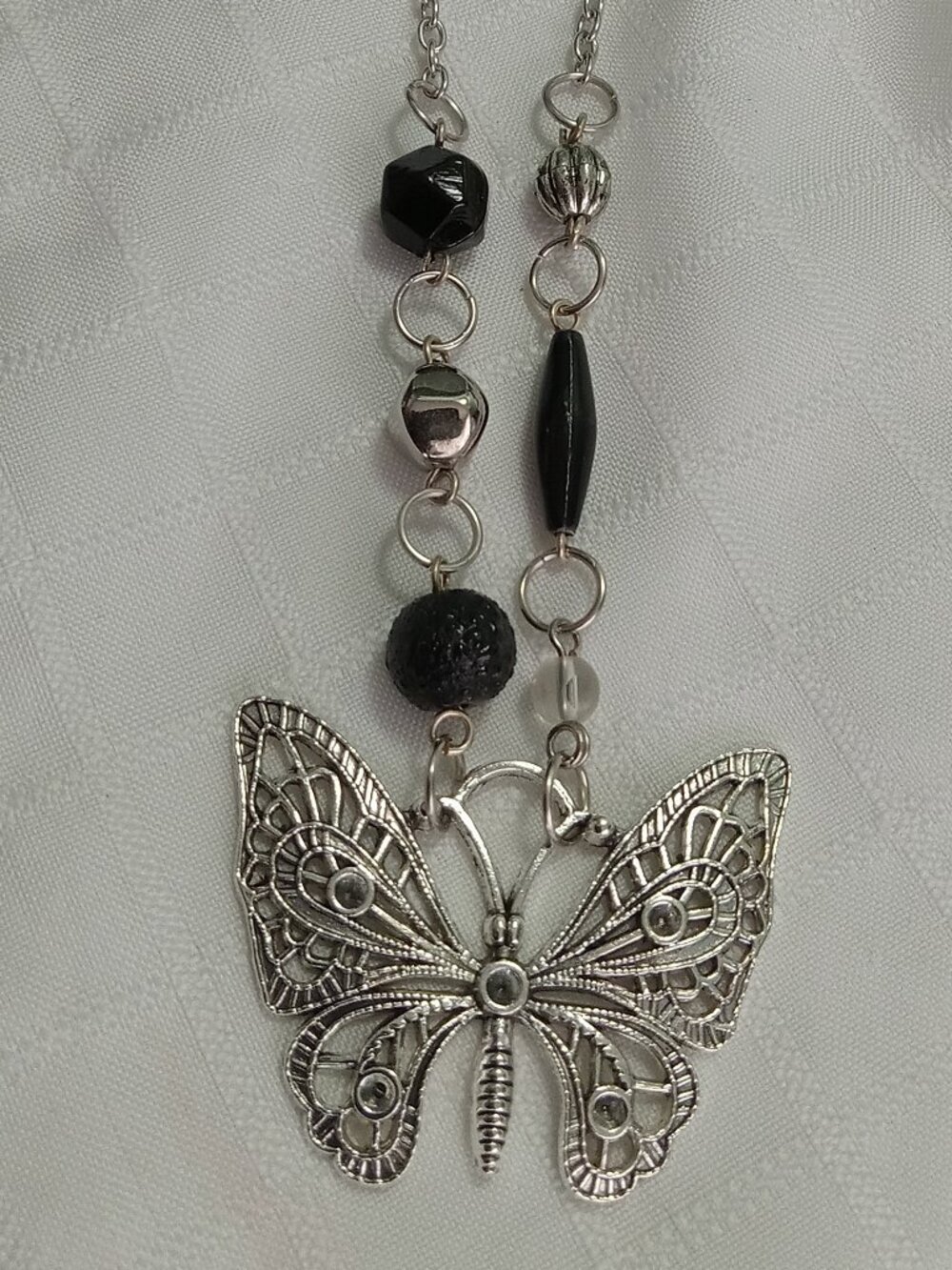 A pretty, minimalist, asymmetrical, reversible handmade necklace